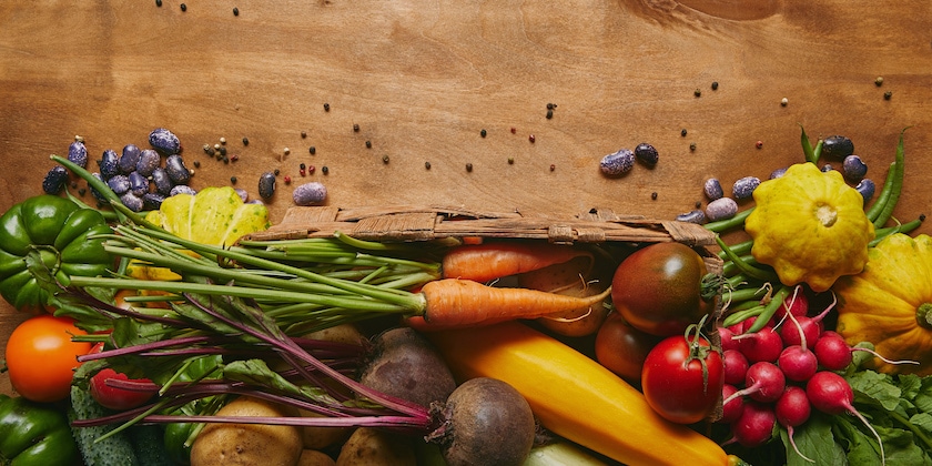 Whole food template with fresh vegetables on wooden table